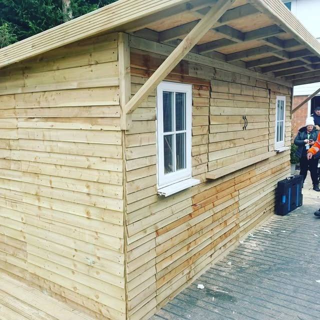 Completed timber garden room with cladding and windows