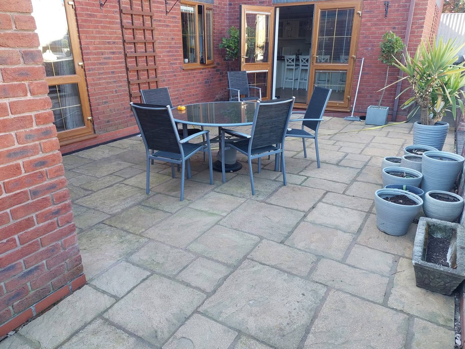 A finished patio area set up with garden furniture